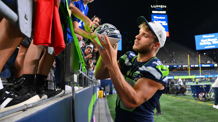 Seattle Seahawks wide receiver Cooper Kupp interacts with fans after the game against the Las Vegas Raiders at Lumen Field.