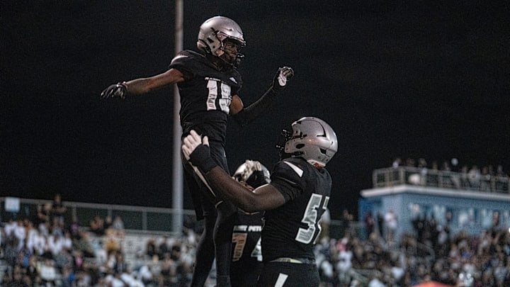 St. Peter Prep's Amari Jones (10) celebrates with his teammate Olubobola Oluwasemilore (52) during a high school football game between St. Peter’s Prep and Paramus Catholic in Jersey City on Friday, Aug. 29, 2025.