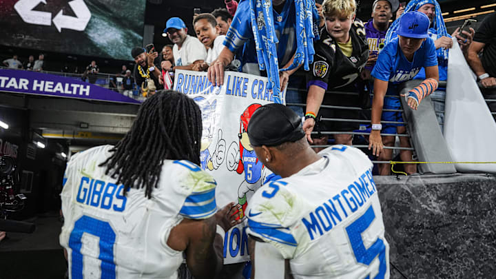 Detroit Lions running backs Jahmyr Gibbs and David Montgomery sign autographs for Lions fans after the 38-30 win over the Baltimore Ravens at M&T Bank Stadium in Baltimore on Monday, Sept. 22, 2025.