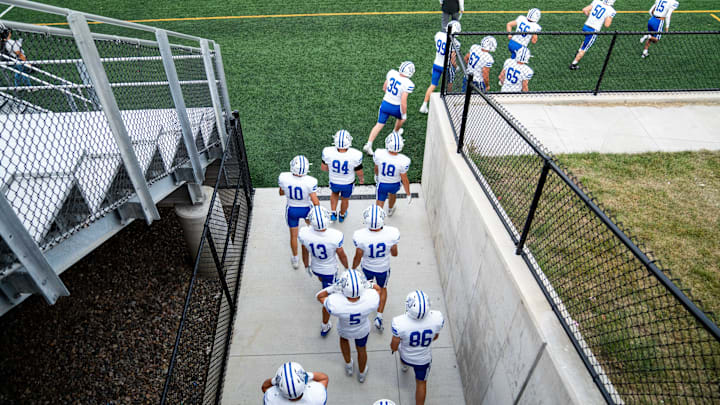 The Waukee Northwest football team takes the field for a game against Des Moines Roosevelt on Thursday, Sept. 12, 2024, at Mediacom Stadium.