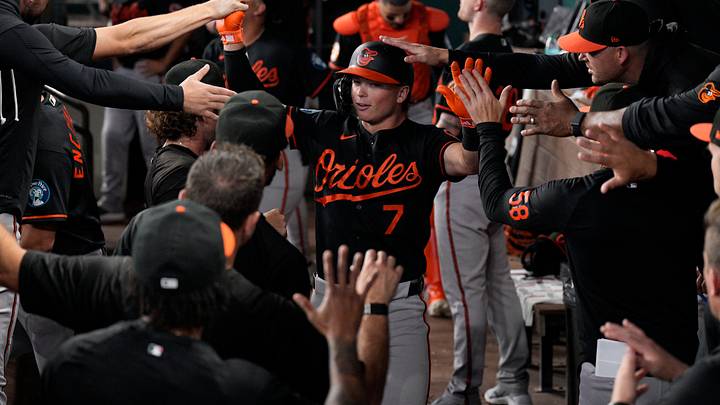 Aug 8, 2026; Arlington, Texas, USA; Baltimore Orioles second baseman Jackson Holliday (7) is greeted in the dugout after hitting a solo home run against the Texas Rangers during the first inning at Globe Life Field. Mandatory Credit: Raymond Carlin III-Imagn Images Aug 8, 2026; Arlington, Texas, USA; Baltimore Orioles second baseman Jackson Holliday (7) is greeted in the dugout after hitting a solo home run against the Texas Rangers during the first inning at Globe Life Field. Mandatory Credit: Raymond Carlin III-Imagn Images