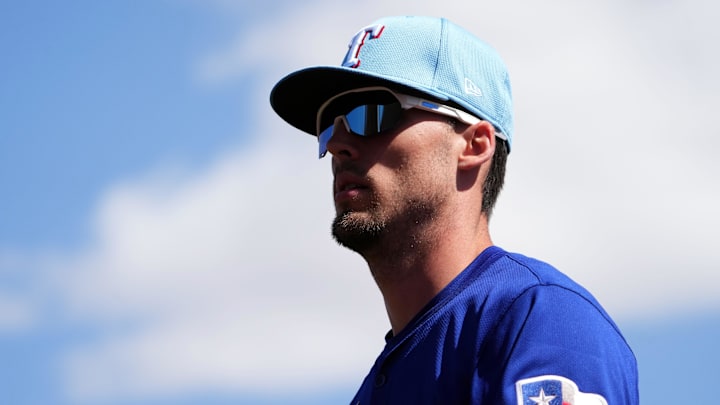 Mar 6, 2025; Phoenix, Arizona, USA; Texas Rangers outfielder Evan Carter (32) looks on against the Los Angeles Dodgers during the first inning at Camelback Ranch-Glendale. Mar 6, 2025; Phoenix, Arizona, USA; Texas Rangers outfielder Evan Carter (32) looks on against the Los Angeles Dodgers during the first inning at Camelback Ranch-Glendale.