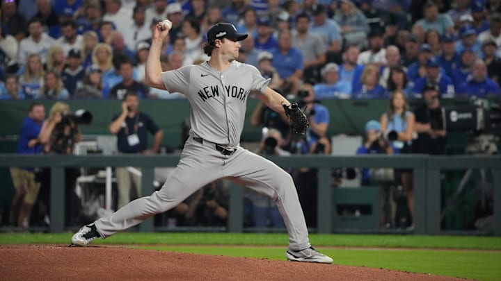 Oct 10, 2024; Kansas City, Missouri, USA; New York Yankees pitcher Gerrit Cole (45) throws a pitch during the first inning against the Kansas City Royals during game four of the ALDS for the 2024 MLB Playoffs at Kauffman Stadium. Mandatory Credit: Denny Medley-Imagn Images