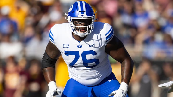 Nov 23, 2024; Tempe, Arizona, USA; Brigham Young Cougars offensive lineman Caleb Etienne (76) against the Arizona State Sun Devils at Mountain America Stadium. Mandatory Credit: Mark J. Rebilas-Imagn Images