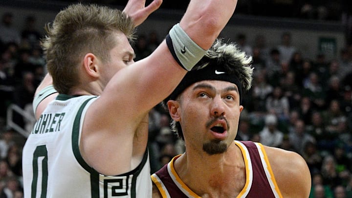 Jan 28, 2025; East Lansing, Michigan, USA; Minnesota Golden Gophers forward Dawson Garcia (3) tries to get past Michigan State Spartans forward Jaxon Kohler (0) during the first half at Jack Breslin Student Events Center. Mandatory Credit: Dale Young-Imagn Images Jan 28, 2025; East Lansing, Michigan, USA; Minnesota Golden Gophers forward Dawson Garcia (3) tries to get past Michigan State Spartans forward Jaxon Kohler (0) during the first half at Jack Breslin Student Events Center. Mandatory Credit: Dale Young-Imagn Images