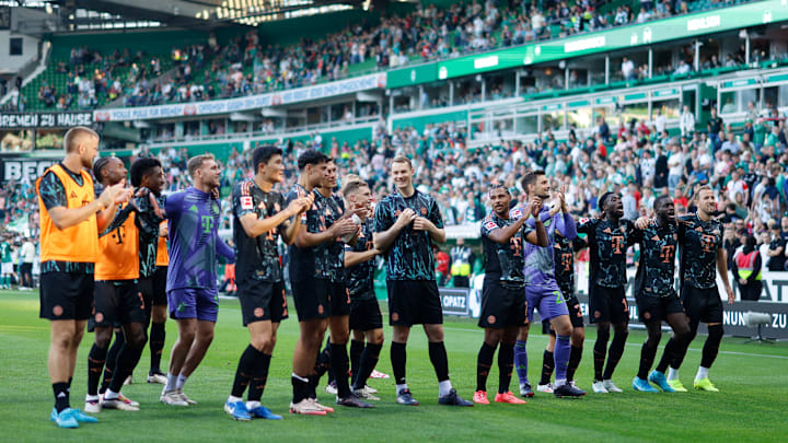 Bayern Munich players celebrating with away fans after defeating Werder Bremen on matchday four of the Bundesliga.