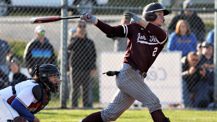 John Glenn shortstop Colt Emerson hits a double against West Muskingum during a game on March 21, 2023.