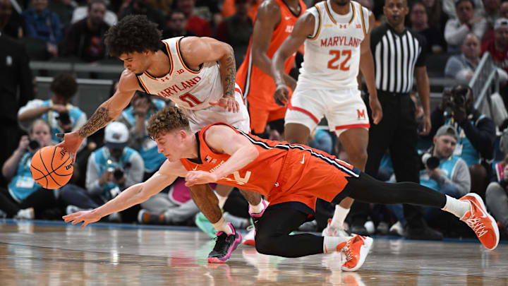 Mar 14, 2025; Indianapolis, IN, USA; Maryland Terrapins guard Ja'Kobi Gillespie (0) steals the ball from Illinois Fighting Illini guard Kasparas Jakucionis (32) during the first half at Gainbridge Fieldhouse. Mandatory Credit: Robert Goddin-Imagn Images