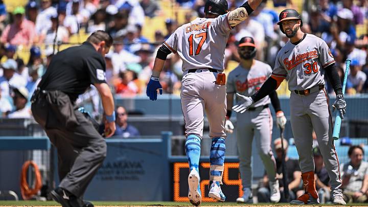 Jun 21, 2026; Los Angeles, California, USA; Baltimore Orioles right fielder Colton Cowser (17) is greeted at home plate by center fielder Leody Taveras (30) after hitting a solo home run against the Los Angeles Dodgers during the third inning at Dodger Stadium. Mandatory Credit: Jonathan Hui-Imagn Images Jun 21, 2026; Los Angeles, California, USA; Baltimore Orioles right fielder Colton Cowser (17) is greeted at home plate by center fielder Leody Taveras (30) after hitting a solo home run against the Los Angeles Dodgers during the third inning at Dodger Stadium. Mandatory Credit: Jonathan Hui-Imagn Images