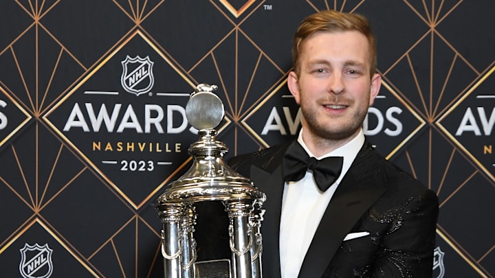 Jun 26, 2023; Nashville, Tennessee, USA; Boston Bruins goaltender Linus Ullmark poses with the Vezina Trophy during the 2023 NHL Awards at Bridgestone Arena. Mandatory Credit: Christopher Hanewinckel-Imagn Images