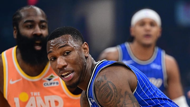 Mar 24, 2026; Cleveland, Ohio, USA; Orlando Magic forward Jamal Cain (8) goes to the basket against Cleveland Cavaliers guard Donovan Mitchell (45) during the first half at Rocket Arena. Mandatory Credit: David Dermer-Imagn Images
