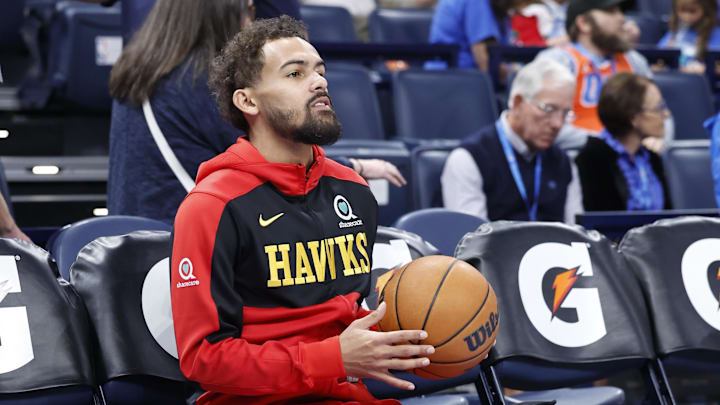 Oct 27, 2024; Oklahoma City, Oklahoma, USA; Atlanta Hawks guard Trae Young (11) sits on the bench during warms ups before the start of a game against the Oklahoma City Thunder at Paycom Center. Mandatory Credit: Alonzo Adams-Imagn Images Oct 27, 2024; Oklahoma City, Oklahoma, USA; Atlanta Hawks guard Trae Young (11) sits on the bench during warms ups before the start of a game against the Oklahoma City Thunder at Paycom Center. Mandatory Credit: Alonzo Adams-Imagn Images