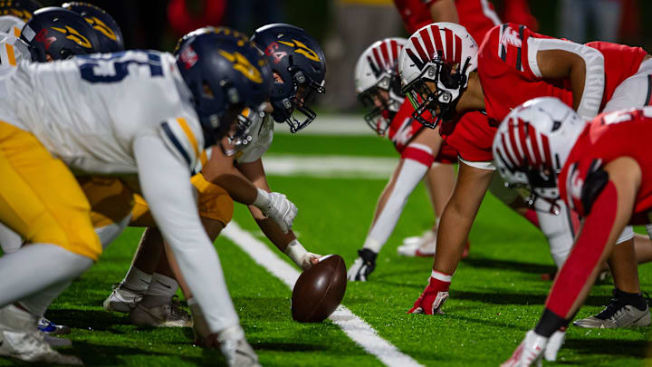 Streetsboro and Field line up for the first play of the game Friday, Oct. 18, 2024, at Field High School.