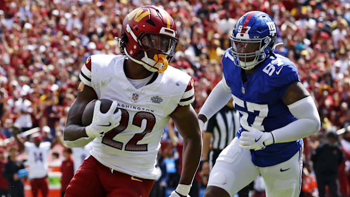 Sep 7, 2025; Landover, Maryland, USA; Washington Commanders running back Jacory Croskey-Merritt (22) scores a touchdown during the second quarter against the New York Giants at Northwest Stadium. 