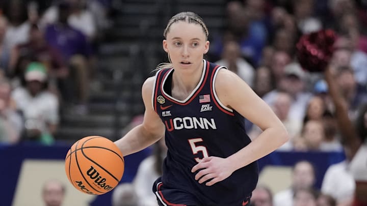 Apr 6, 2025; Tampa, FL, USA; Connecticut Huskies guard Paige Bueckers (5) dribbles the ball against the South Carolina Gamecocks during the second half of the national championship of the women's 2025 NCAA tournament at Amalie Arena. Mandatory Credit: Kirby Lee-Imagn Images