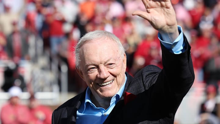 Nov 16, 2024; Fayetteville, Arkansas, USA; Dallas Cowboys owner and member of the 1964 Arkansas Razorbacks National Championship team, Jerry Jones, waves to the crowd as the team is honored during the first half against the Texas Longhorns at Donald W. Reynolds Razorback Stadium. Mandatory Credit: Nelson Chenault-Imagn Images