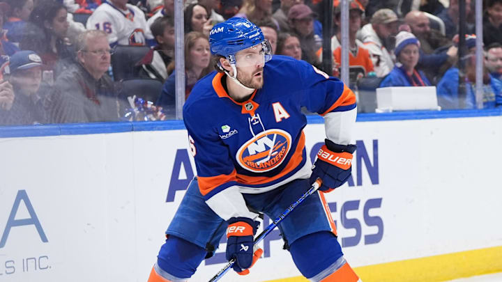 Apr 3, 2026; Elmont, New York, USA;  New York Islanders defenseman Ryan Pulock (6) carries the puck in the third period against the Philadelphia Flyers at UBS Arena. Mandatory Credit: Alexander Wohl-Imagn Images