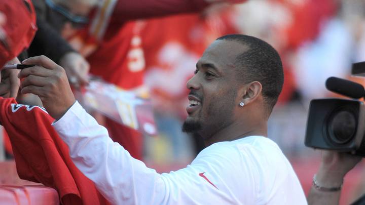 Dec 1, 2013; Kansas City, MO, USA; Kansas City Chiefs inside linebacker Derrick Johnson (56) signs autographs for fans before the game against the Denver Broncos at Arrowhead Stadium. Denver won 35-28. Mandatory Credit: Denny Medley-USA TODAY Sports