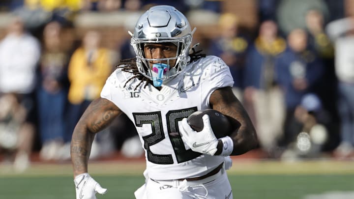 Nov 2, 2024; Ann Arbor, Michigan, USA;  Oregon Ducks running back Jordan James (20) rushes against the Michigan Wolverines at Michigan Stadium. Mandatory Credit: Rick Osentoski-Imagn Images