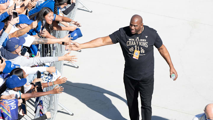Nov 1, 2024; Los Angeles, CA, USA; Los Angeles Dodgers minority owner and former Los Angeles Lakers player Magic Johnson arrives at Dodger Stadium for the teamís World Series Championship celebration. Mandatory Credit: Sandy Hooper-USA TODAY via Imagn Images