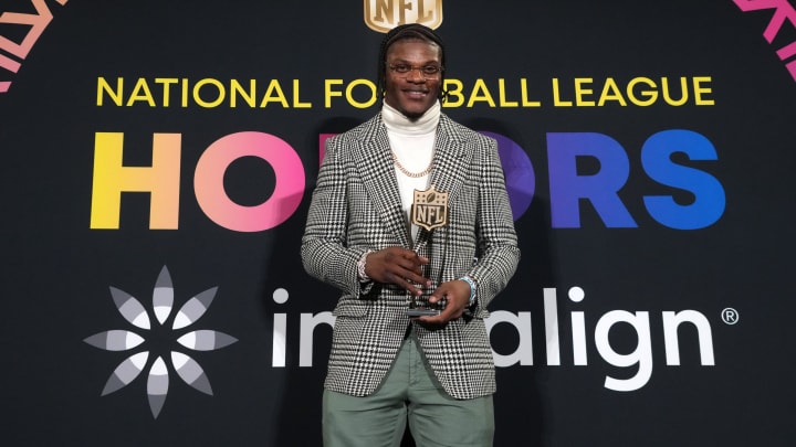 Feb 8, 2024; Las Vegas, NV, USA; Baltimore Ravens quarterback Lamar Jackson poses with the most valuable player trophy during the Pro Football Hall of Fame Class of 2024 press conference at the Resorts World Theatre. Mandatory Credit: Kirby Lee-USA TODAY Sports