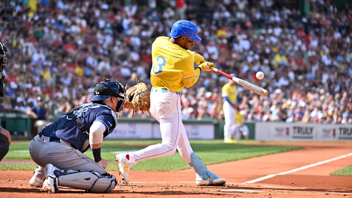 Jul 12, 2025; Boston, Massachusetts, USA;  Boston Red Sox second baseman Ceddanne Rafaela (3) hits a single against the Tampa Bay Rays during the first inning at Fenway Park. Mandatory Credit: Eric Canha-Imagn Images