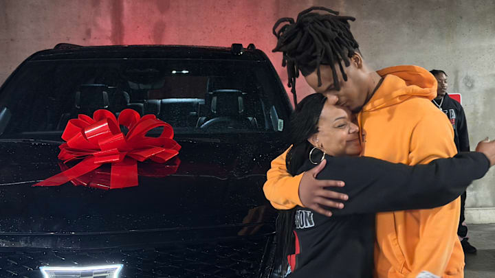Indiana basketball senior guard Lamar Wilkerson and his mom, Kizzy Stewart, share a hug after Lamar gifted Kizzy a new Cadillac Escalade on March 4, 2026, in Bloomington.