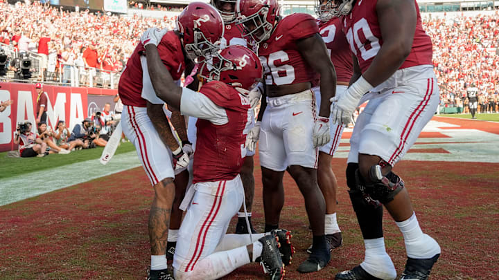 Alabama wide receiver Germie Bernard (5) celebrates with teammates after scoring a touchdown against Vanderbilt in the moments before halftime at Saban Field at Bryant-Denny Stadium. 