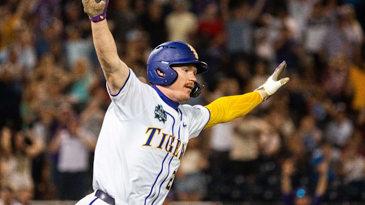 Jun 18, 2025; Omaha, Neb, USA; LSU Tigers first baseman Jared Jones (22) celebrates after hitting a walk off RBI single against the Arkansas Razorbacks during the ninth inning at Charles Schwab Field. Mandatory Credit: Dylan Widger-Imagn Images