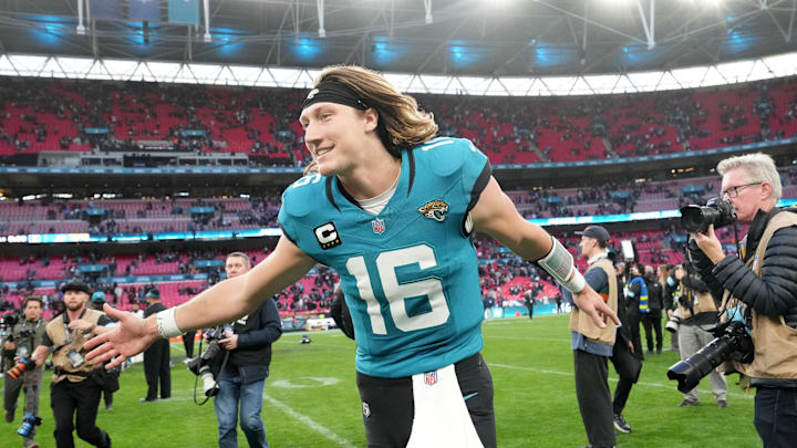 Oct 20, 2024; London, United Kingdom; Jacksonville Jaguars quarterback Trevor Lawrence (16) celebrates after the game against the New England Patriots in an NFL International Series game at Wembley Stadium. Mandatory Credit: Kirby Lee-Imagn Images
