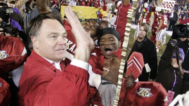 Nov. 23, 2007; Baton Rouge, LA, USA; Arkansas Razorbacks head coach Houston Nutt celebrates with his team after their 50-48 triple overtime victory over the top ranked LSU Tigers at Tiger Stadium. Mandatory Credit: John David Mercer-Imagn Images Copyright © 2007 John David Mercer