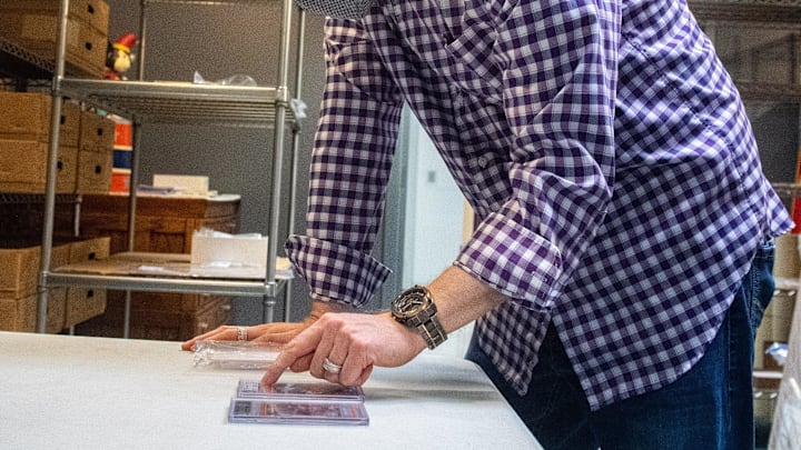 President of Hake's Auctions, Alex Winter, explains why one Michael Jordan rookie card is worth more than the other at Hake's Auctions / Cameron Clark via Imagn Content Services, LLC