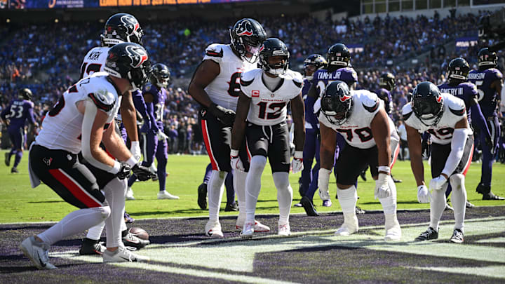 Oct 5, 2025; Baltimore, Maryland, USA; Houston Texans wide receiver Nico Collins (12) celebrates a touchdown with teammates during the second quarter against the Baltimore Ravens at M&T Bank Stadium. Mandatory Credit: Rafael Suanes-Imagn Images Oct 5, 2025; Baltimore, Maryland, USA; Houston Texans wide receiver Nico Collins (12) celebrates a touchdown with teammates during the second quarter against the Baltimore Ravens at M&T Bank Stadium. Mandatory Credit: Rafael Suanes-Imagn Images