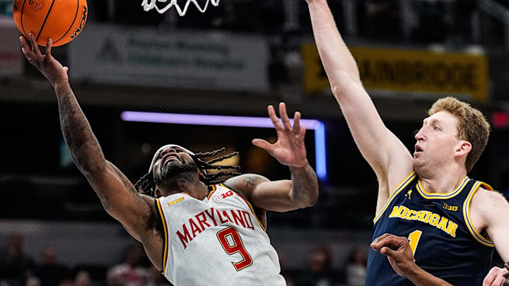 Maryland guard Selton Miguel (9) goes to the basket against Michigan center Danny Wolf (1) during the second half of Big Ten Tournament semifinal at Gainbridge Fieldhouse in Indianapolis, Ind. on Saturday, March 15, 2025. Maryland guard Selton Miguel (9) goes to the basket against Michigan center Danny Wolf (1) during the second half of Big Ten Tournament semifinal at Gainbridge Fieldhouse in Indianapolis, Ind. on Saturday, March 15, 2025.