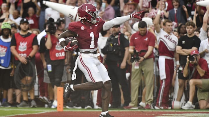 Aug 31, 2024; Tuscaloosa, Alabama, USA;  Alabama Crimson Tide wide receiver Kendrick Law (1) celebrates after scoring a touchdown against the Western Kentucky Hilltoppers during the first half at Bryant-Denny Stadium.  Mandatory Credit: Gary Cosby Jr.-Imagn Images