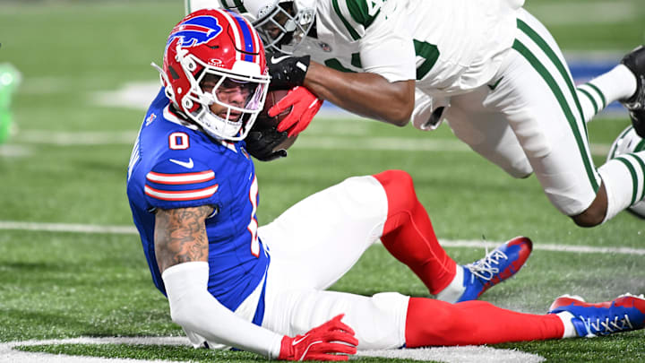 Jan 4, 2026; Orchard Park, New York, USA; New York Jets safety Keidron Smith (46) tackles Buffalo Bills wide receiver Keon Coleman (0) during the third quarter at Highmark Stadium.