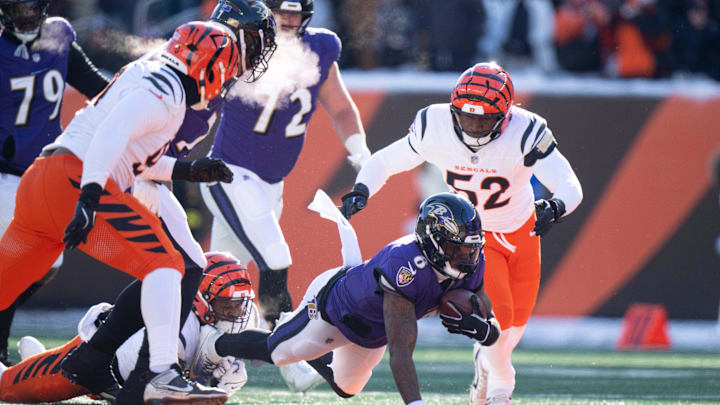 Cincinnati Bengals defensive end Myles Murphy (99) tackles Baltimore Ravens quarterback Lamar Jackson (8) in the first quarter of the NFL football game at Paycor Stadium in Cincinnati on Dec. 14, 2025.