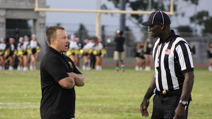 San Pedro football coach Corey Walsh talks to an official before his team takes on Garfield on Friday, Sept. 13, 2024. San Pedro football coach Corey Walsh talks to an official before his team takes on Garfield on Friday, Sept. 13, 2024.