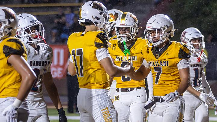 Mililani QB Hunter Fujikawa celebrates with RB Toa Sam after the Trojans took a late lead over Liberty on Aug. 14. The Trojans will face Liberty's Henderson, Nevada, rivals from Foothill this Saturday. Mililani QB Hunter Fujikawa celebrates with RB Toa Sam after the Trojans took a late lead over Liberty on Aug. 14. The Trojans will face Liberty's Henderson, Nevada, rivals from Foothill this Saturday.