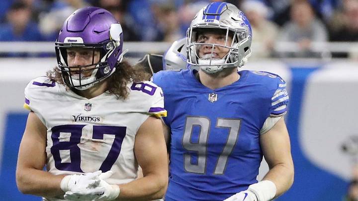 Lions defensive end Aidan Hutchinson and Vikings tight end T.J. Hockenson on the field during the second half of the Lions' 34-23 win over the Vikings on Sunday, Dec. 11, 2022, at Ford Field.