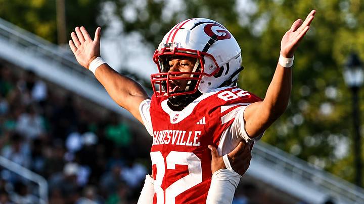 Dwayne Carter III, son of rap legend Lil Wayne, celebrates a successful kick for the Gainesville (Ga.) football team.