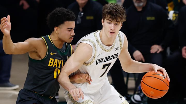 Feb 4, 2026; Waco, Texas, USA; Colorado Buffaloes forward Sebastian Rancik (7) controls the ball as Baylor Bears guard Isaac Williams (10) defends during the first half at Paul and Alejandra Foster Pavilion. Mandatory Credit: Chris Jones-Imagn Images