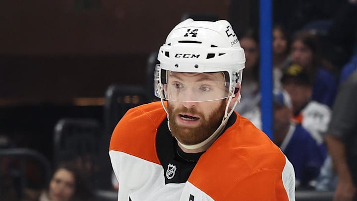 Mar 17, 2025; Tampa, Florida, USA;  Philadelphia Flyers center Sean Couturier (14) against the Tampa Bay Lightning during the second period at Amalie Arena. Mandatory Credit: Kim Klement Neitzel-Imagn Images