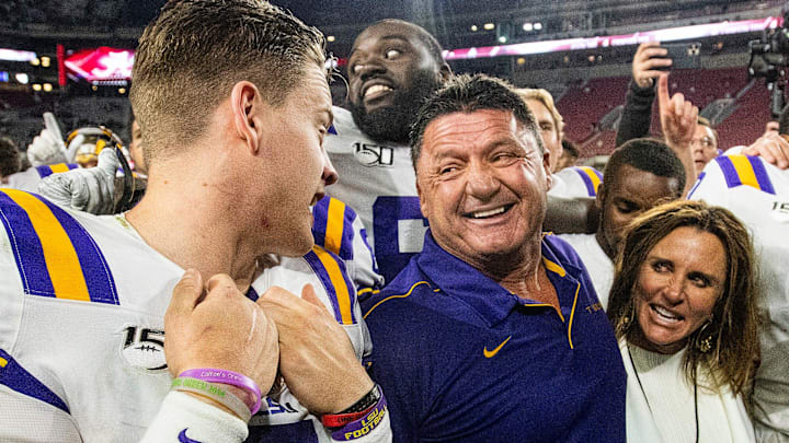 LSU quarterback Joe Burrow (9) talks with LSU head coach Ed Orgeron