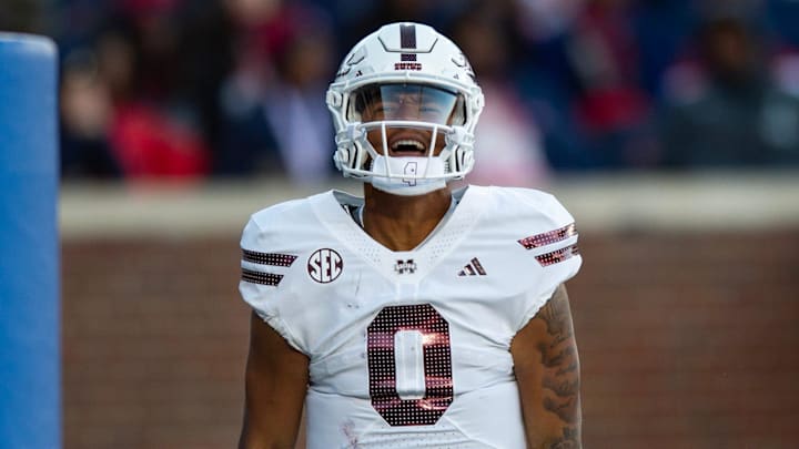 Mississippi State's quarterback Michael Van Buren Jr. (0) celebrates scoring a touchdown during the Egg Bowl game against Mississippi at Vaught-Hemingway Stadium on Friday, Nov. 29, 2024.