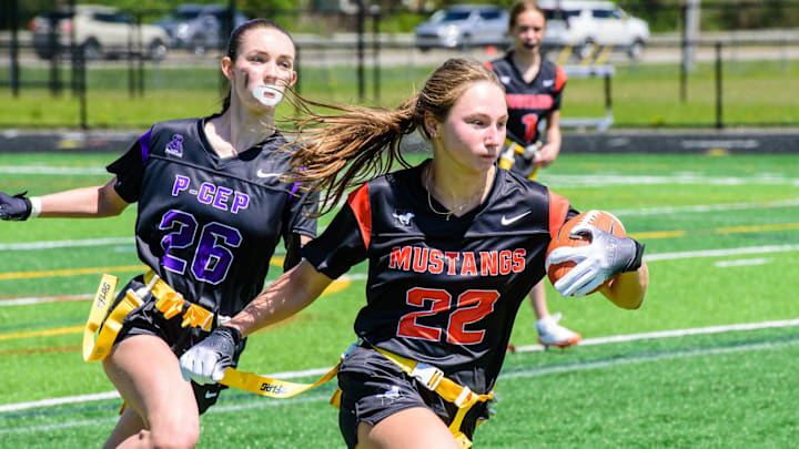 Northville's Isabella DeFore rushes during a Michigan Girls High School Flag Football League football game on Sunday, April 26, 2026.
