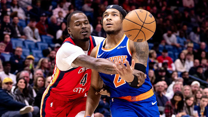 Dec 21, 2024; New Orleans, Louisiana, USA;  New York Knicks guard Miles McBride (2) is fouled by New Orleans Pelicans guard Javonte Green (4) during the first half at Smoothie King Center. Mandatory Credit: Stephen Lew-Imagn Images
