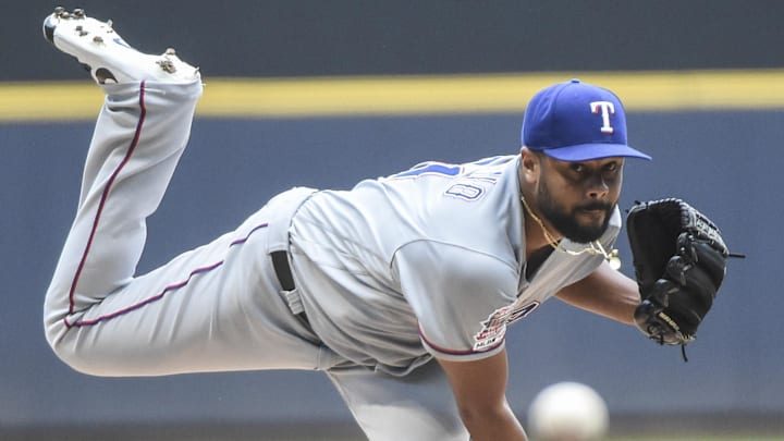 Texas Rangers pitcher Pedro Payano (51) throws a pitch.
