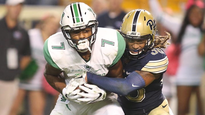 Oct 1, 2016; Pittsburgh, PA, USA;  Marshall Thundering Herd wide receiver Michael Clark (7) runs after a catch against Pittsburgh Panthers defensive back Ryan Lewis (38) during the fourth quarter at Heinz Field. Pittsburgh won 43-27. Mandatory Credit: Charles LeClaire-Imagn Images