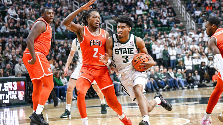 Michigan State's Jaden Akins, right, moves the ball as Bowling Green's Javontae Campbell defends during the first half on Saturday, Nov. 16, 2024, Breslin Center in East Lansing.